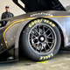 The front left corner of a black Chevrolet Camaro stock car